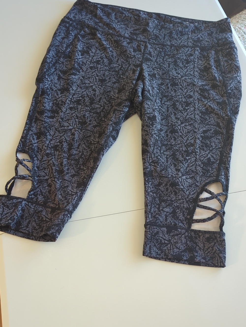 Livi Active Black Patterned Capri Leggings with Lattice Side Cutouts